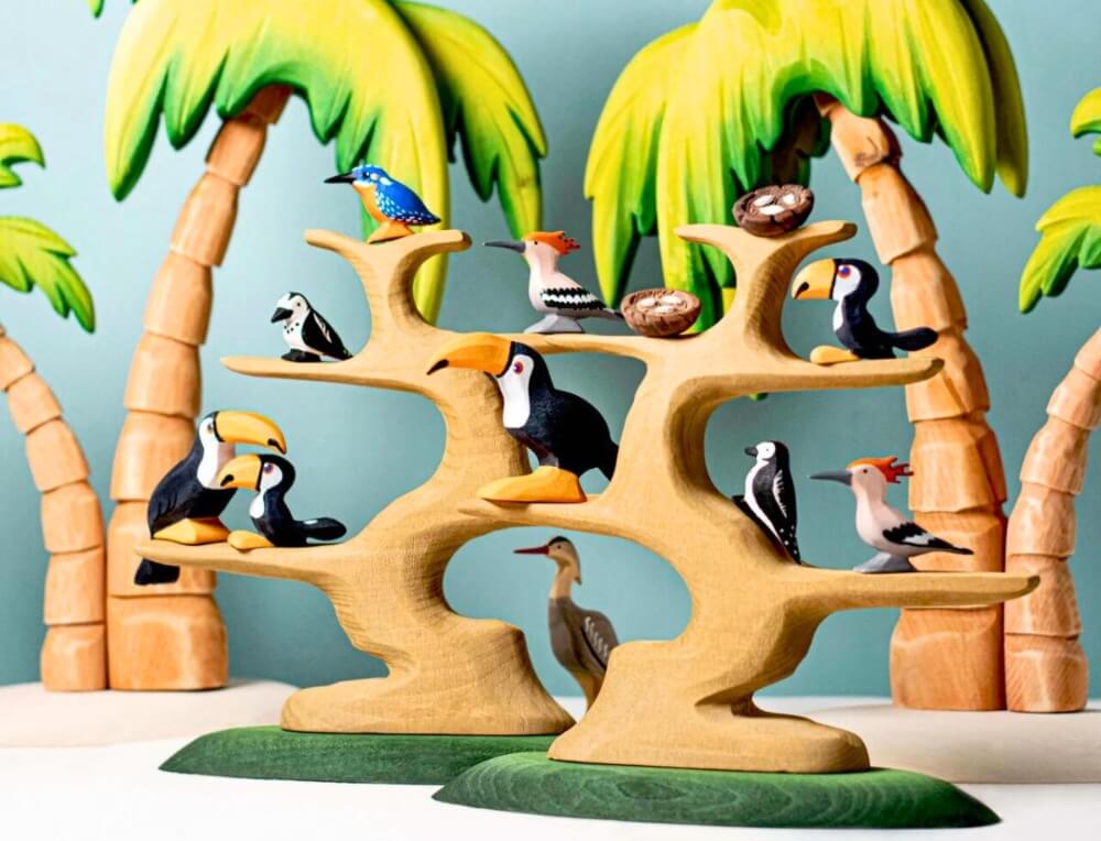 Small world play scene with Bumbu wooden bird figurines, available in Australia from Oskar's Wooden Ark