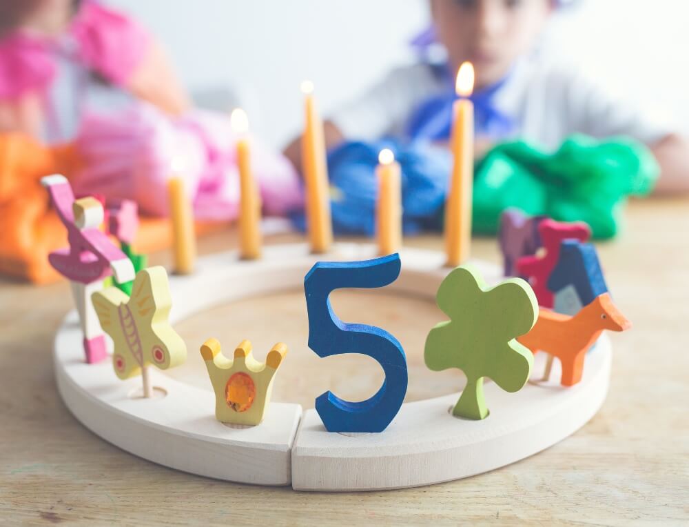 Colourful Grimm's wooden celebration figures and number for Waldorf Birthday Celebration Ring - available in Australia from Oskar's Wooden Ark