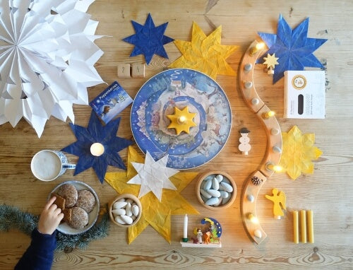 Christmas table centrepiece with Grimm's celebration ring, Christmas ornaments and beeswax candles at Oskar's Wooden Ark in Australia