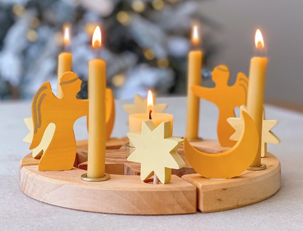 Christmas Waldorf celebration ring with Grimm's natural beeswax candles and wooden angel decorative figures, available in Australia from Oskar's Wooden Ark