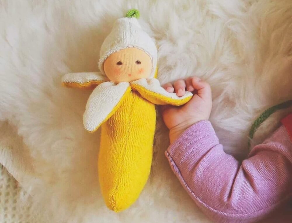 Baby grasping soft, natural Nanchen Natur Banana Rattle Comforter from Oskar's Wooden Ark in Australia