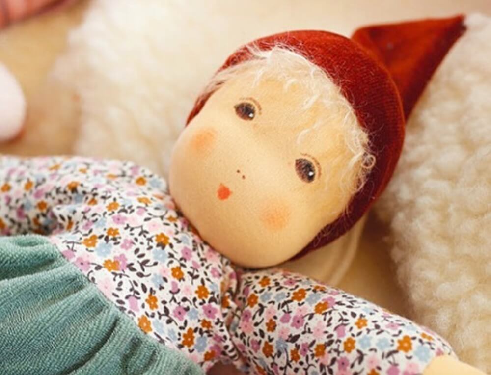 Natural, organic Nanchen Natur soft doll, with hand-painted face and handmade doll's clothing, from Oskar's Wooden Ark in Australia