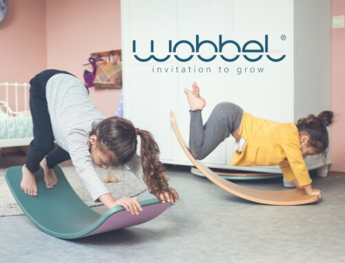 Children rocking on wooden Wobbel Balance Boards from Oskar's Wooden Ark in Australia