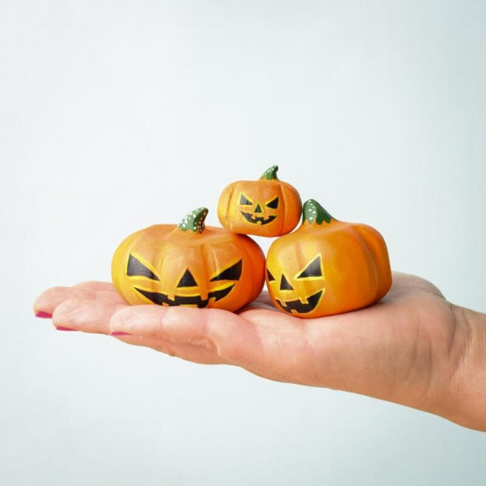 BumbuToys Wooden Halloween Pumpkins Set of 3 Figurines - In Adult's Hand for Size Comparison