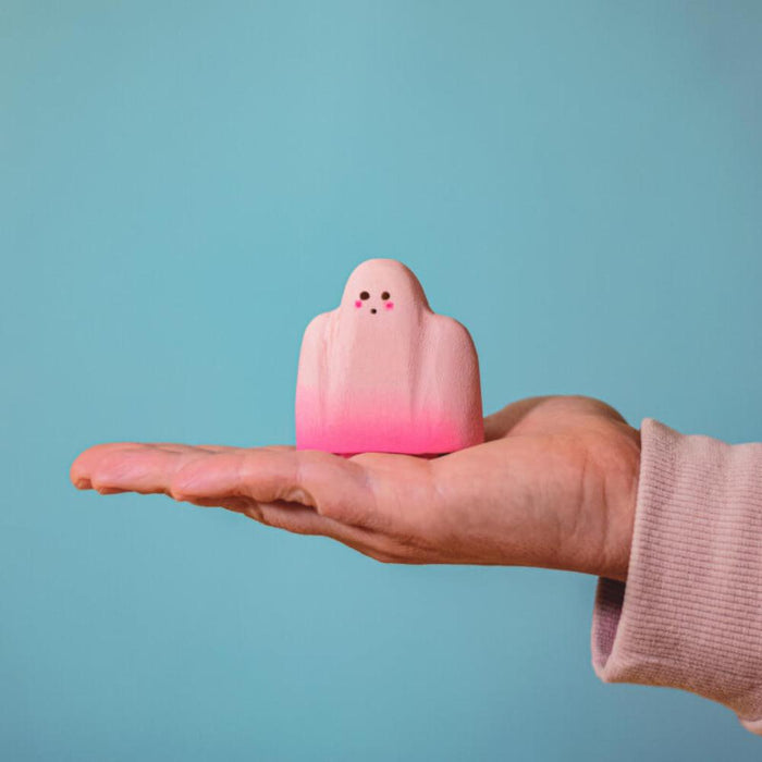 BumbuToys Wooden Pink Ghost Figurine in Adult Hand for Size Comparison