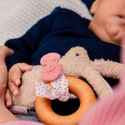 Baby with handcrafted Kathe Kruse cuddly rabbit grasper toy from Oskar's Wooden Ark in Australia