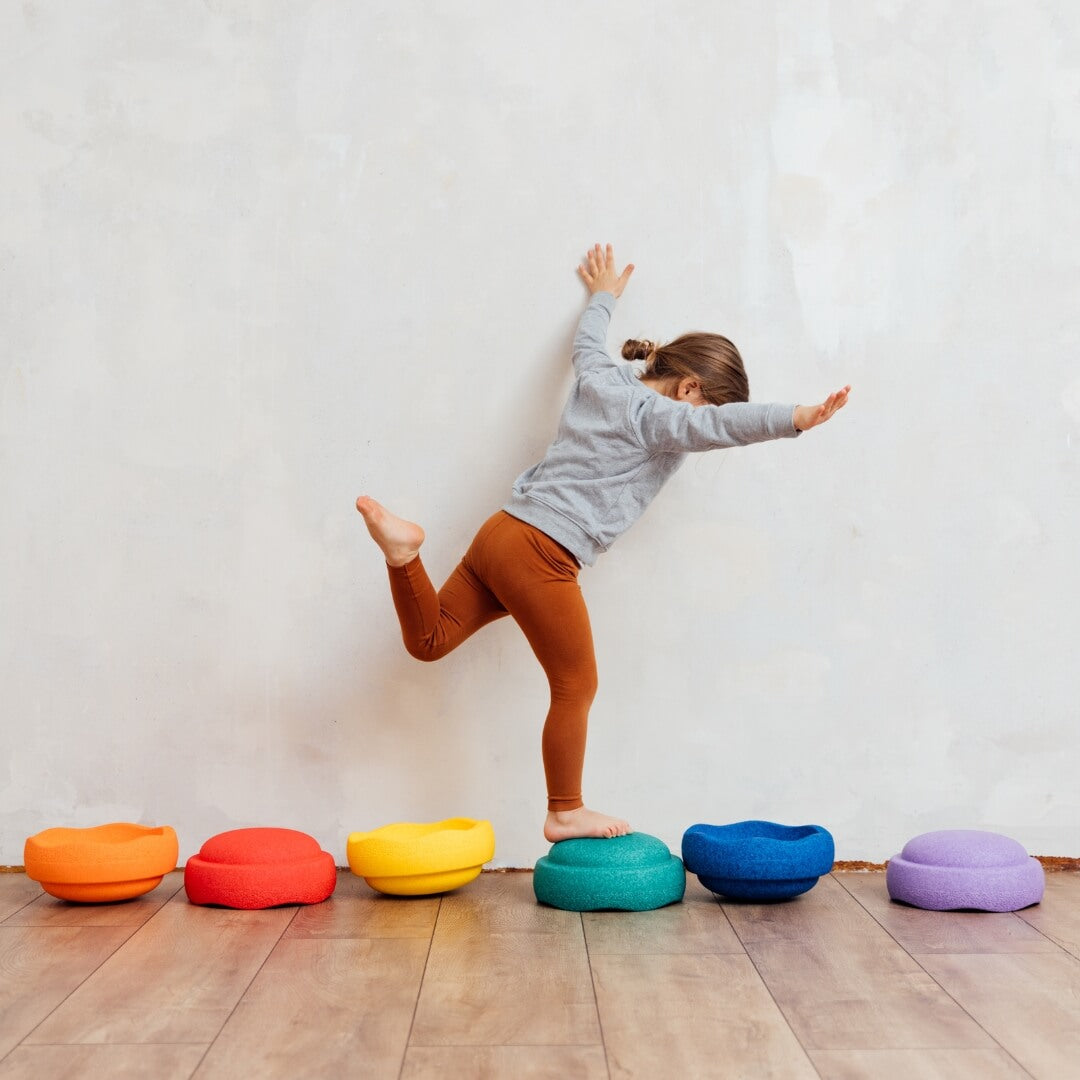 Child balancing on Stapelstein Rainbow Stepping Stones, Australia