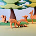 BumbuToys Handcrafted Wooden Animal Grazing Deer Fawn from Australia in a small-world play setting