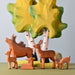 BumbuToys Handcrafted Wooden Farm Animal Deer Fawn Resting from Australia in a small-world play setting