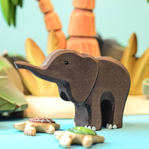 BumbuToys Handcrafted Wooden Animal African Baby Elephant from Australia in a small-world play setting