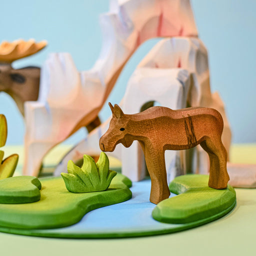 BumbuToys Handcrafted Wooden Animal Moose Calf from Australia in a small-world play setting