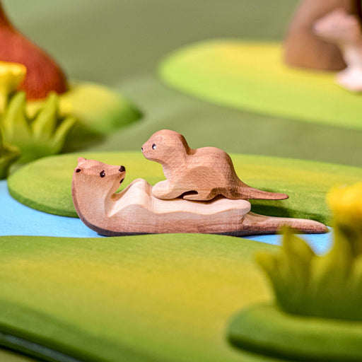 BumbuToys Handcrafted Wooden Animal Sleeping Otter from Australia in a small-world play setting
