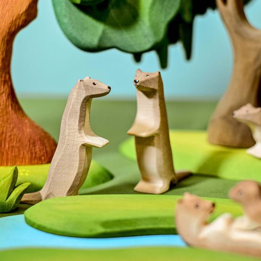 BumbuToys Handcrafted Wooden Animal Otter Standing from Australia in a small-world play setting