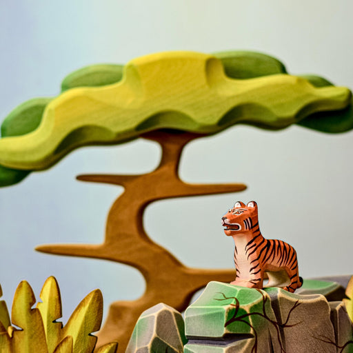 BumbuToys Handcrafted Wooden Animal Tiger Cub Standing from Australia in a small-world play setting