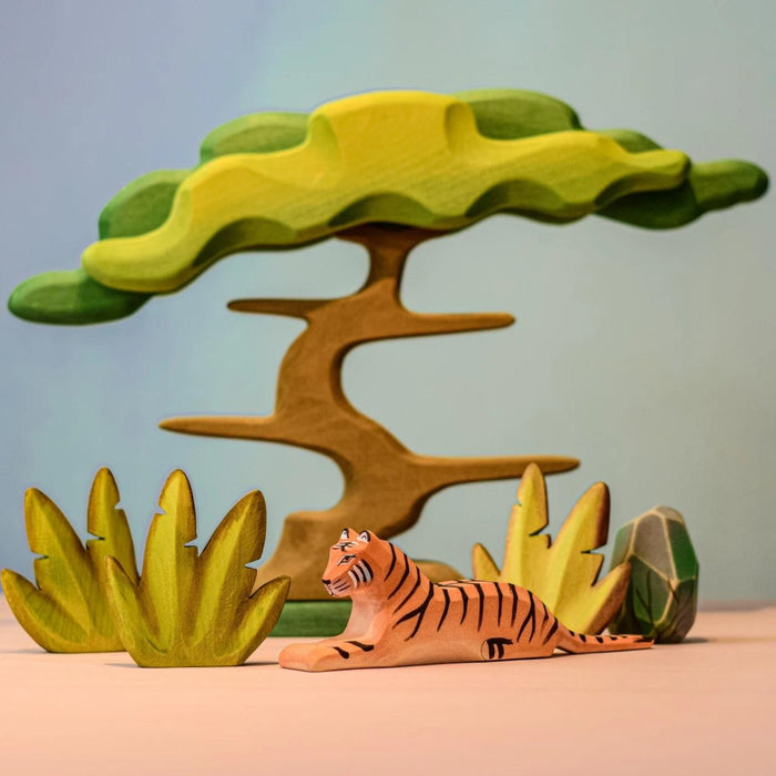 BumbuToys Handcrafted Wooden Animal Tiger Lying from Australia in a small-world play setting
