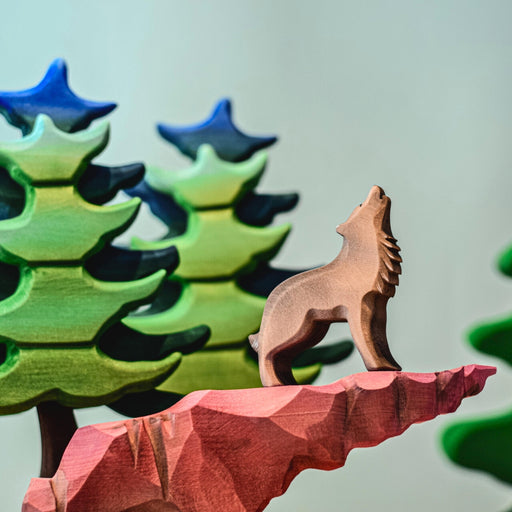 BumbuToys Handcrafted Wooden Animal Howling Wolf from Australia in a small-world play setting