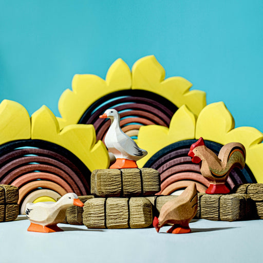 BumbuToys Handcrafted Wooden Farm Birds from Australia in a small-world farm play setting