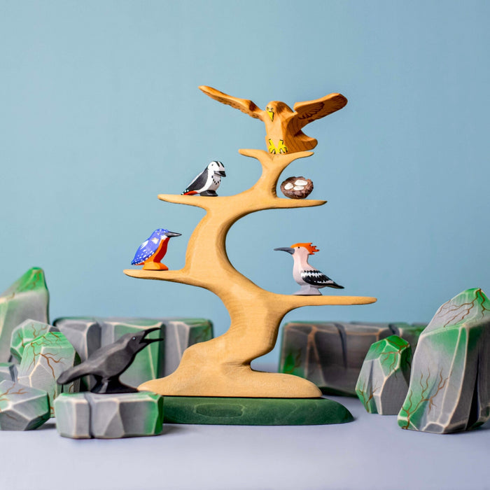 BumbuToys Handcrafted Wooden Bird Eagle from Australia in a small-world play setting
