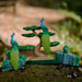 BumbuToys Handcrafted Wooden Bird Peacock from Australia in a small-world play setting
