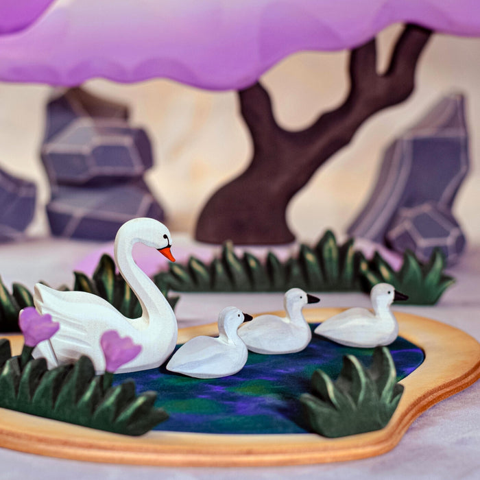 BumbuToys Handcrafted Wooden Swans and Heart Lake Set from Australia in a small-world play setting