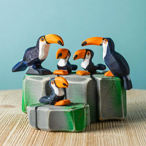 BumbuToys Handcrafted Wooden Bird Toucan Family Set from Australia in a small-world play setting