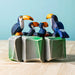 BumbuToys Handcrafted Wooden Bird Toucan Sitting from Australia in a small-world play setting