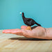 BumbuToys Handcrafted Wooden Bird Turkey Hen from Australia on an adult person's hand