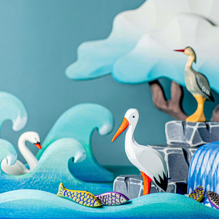 BumbuToys Handcrafted Wooden Bird White Stork from Australia in a small-world play setting