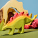 BumbuToys Handcrafted Wooden Dinosaur Stegosaurus from Australia in a small-world play setting