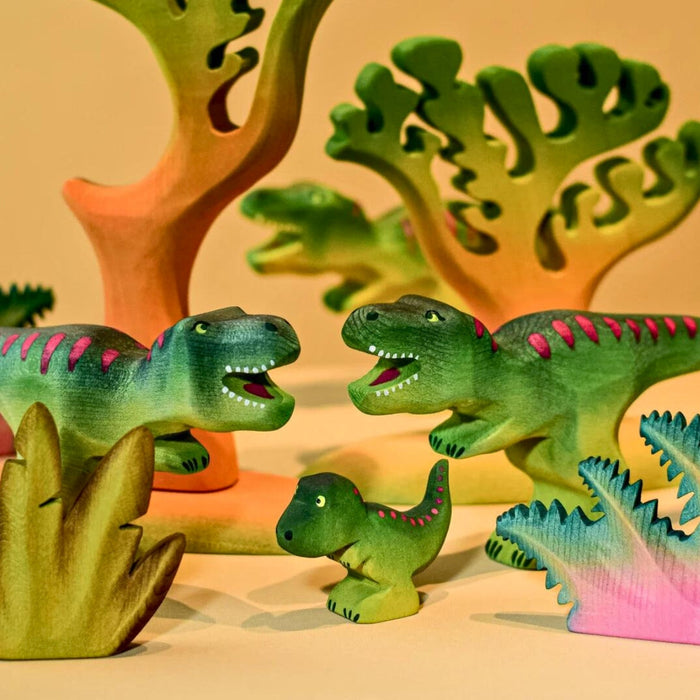 BumbuToys Handcrafted Wooden Dinosaur T-Rex family from Australia in a small-world play setting
