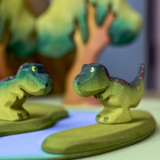 BumbuToys Handcrafted Wooden Dinosaur Babies T-Rex from Australia in a small-world play setting