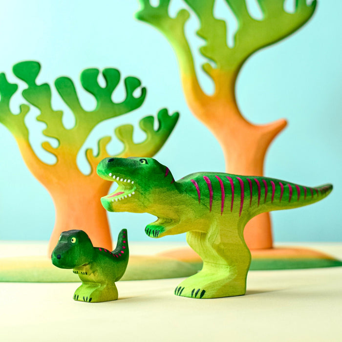 BumbuToys Handcrafted Wooden Dinosaur T-Rex Baby and Big Set from Australia in a small-world play setting