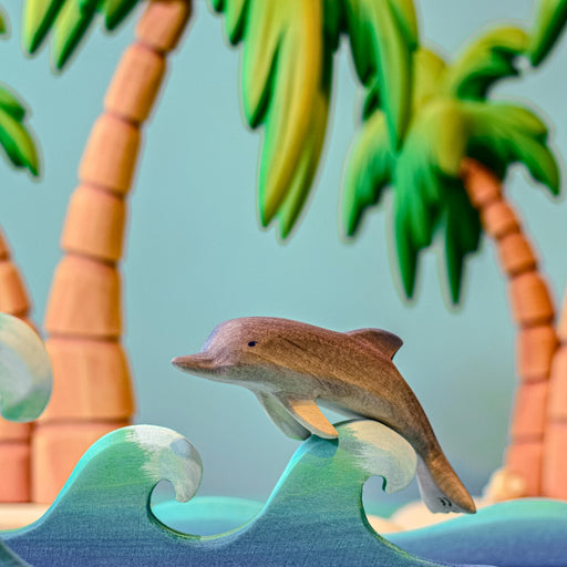 BumbuToys Handcrafted Wooden Dolphin from Australia in a small-world play setting