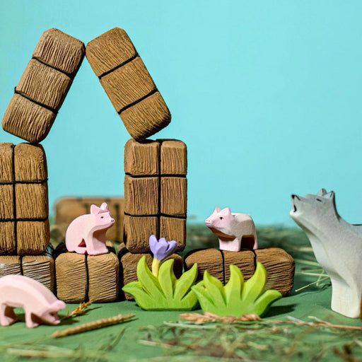 BumbuToys Handcrafted Wooden Farm Animal Piglet Eating from Australia in a small-world play setting