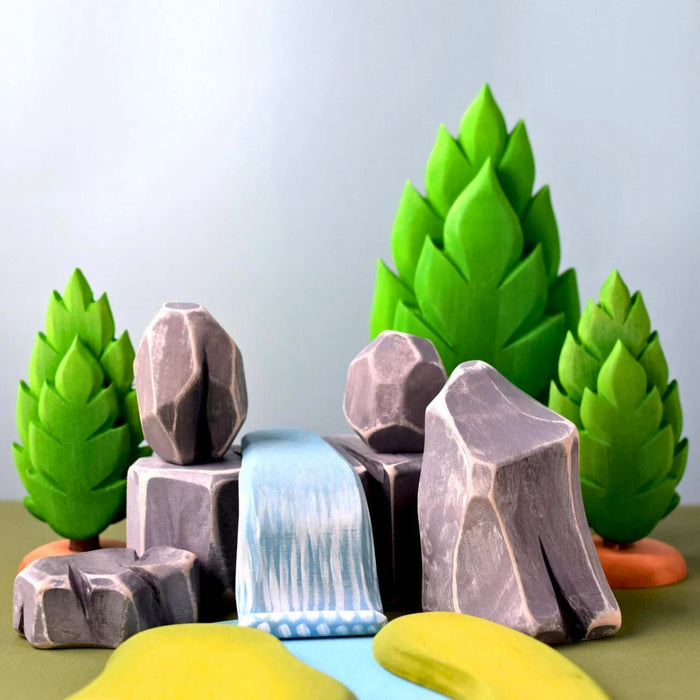 BumbuToys Handcrafted Wooden Landscape River Rocks from Australia in a small-world play setting