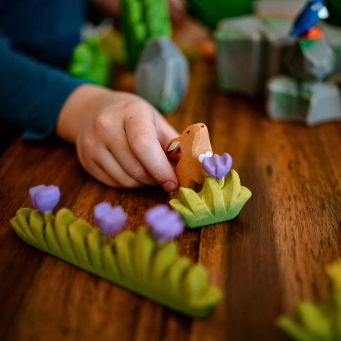 BumbuToys Handcrafted Wooden Plant Figure Small Grass with Lilac Flower from Australia in a small-world play setting