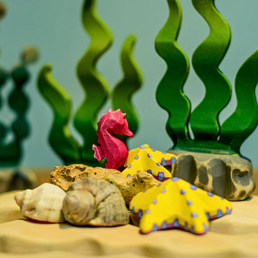 BumbuToys Handcrafted Wooden Seahorse from Australia in a small-world play setting