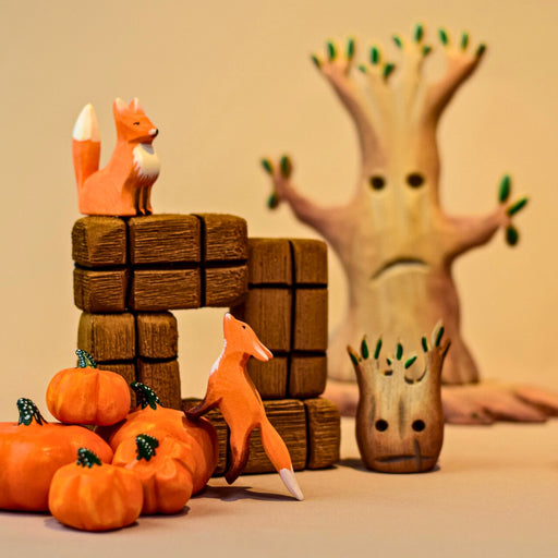 BumbuToys Handcrafted Wooden Farm Figures Pumpkins & Straw Bales Set of 7 from Australia in a small-world play setting