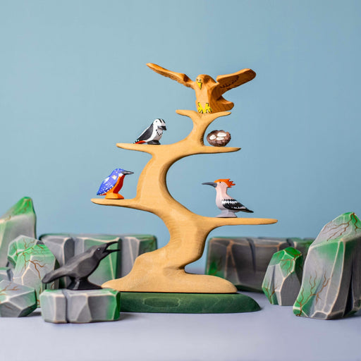 BumbuToys Handcrafted Wooden Tree Bird Perch from Australia in a small-world play setting