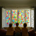 Children drawing on a window using Kitpas removeable rice bran wax crayons from Australia