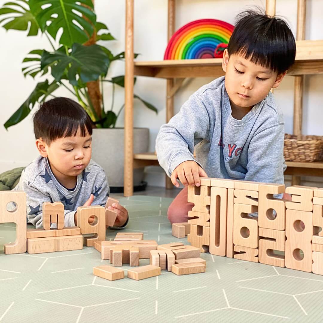 Two boys playing, stacking and learning with SumBlox Educational Number Block Set of 100 Pieces for Educational and Home Learning from Oskar's Wooden Ark in Australia